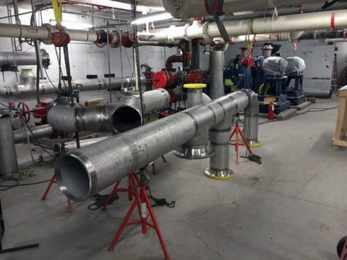 Why would a mechanical contractor consider outsourcing piping fabrication?